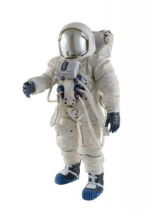 Astronaut wearing spacesuit against a white background