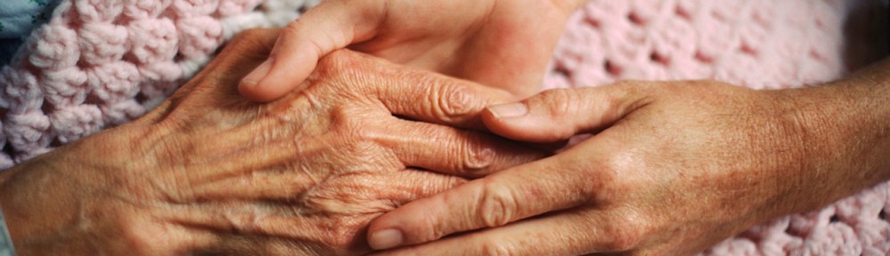 Holding Hands with Elderly Patient