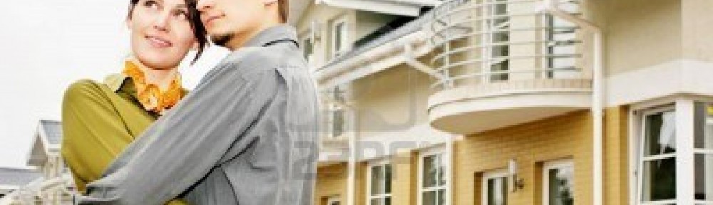 couple in front of house