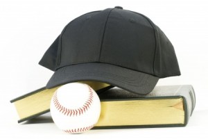 Books, black baseball cap, and baseball rest together against a white background in still life of scholar and athlete objects