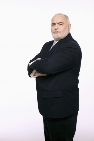 Businessman standing with his arms folded