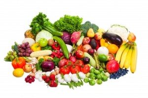 A large group of fruit and vegetables isolated on a white background.