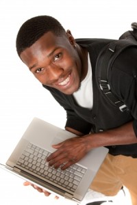Happy African American College Student Working on Laptop