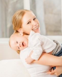 happy family. mother and baby little girl hugging