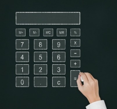 male hand drawing digital calculator on chalkboard