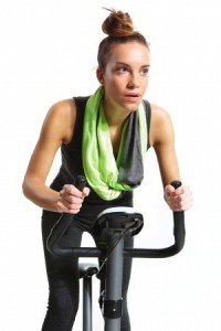 Girl exercising on exercise bike