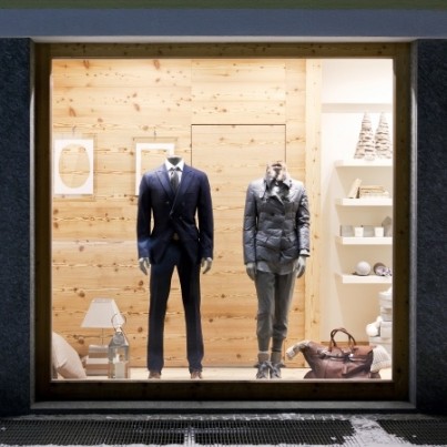 Stylish casual clothing in store at display window, winter collection