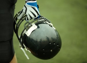 hand of player with black helmet, selective focus