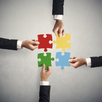 Teamwork and partnership concept with puzzle