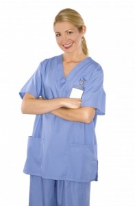 beautiful blond healthcare worker wearing blue uniform scrubs