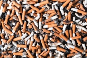 many filter cigarette butts background