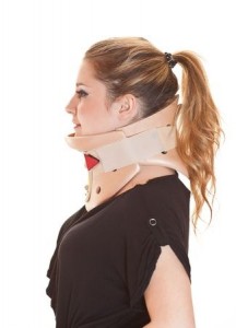 Blonde young woman wearing neck protector, smiling, side view