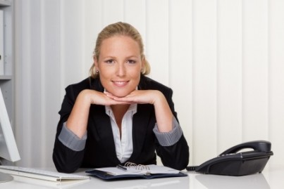 a young successful woman sitting at her desk in the office