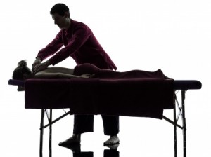 man woman back massage in silhouette studio on white background