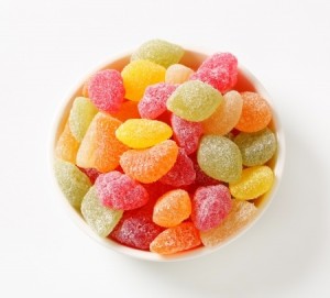 Fruit-shaped gummy candy coated in granulated sugar