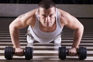 Pushups workout while leaning on weights