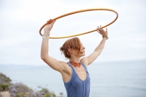 Woman with hoop and the sea and the sky.