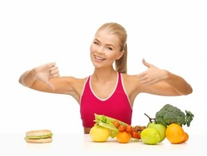 woman with fruits and hamburger showing good and bad signs