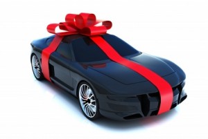 9732379_SThe big gift, sports car with bow, isolated on a white background