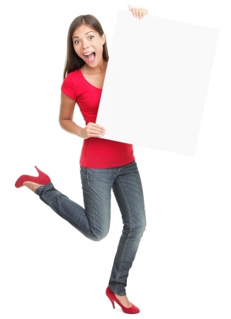 Excited young woman holding empty white board isolated on white background