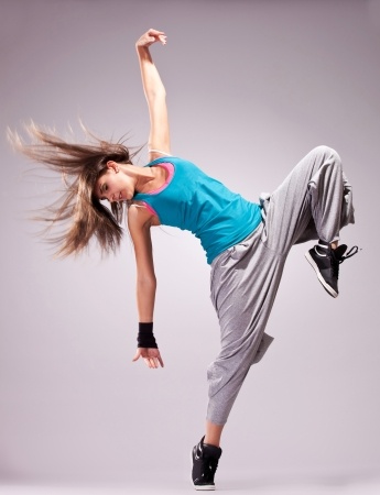 beautiful dance pose of a young woman dancer with fluttering hair