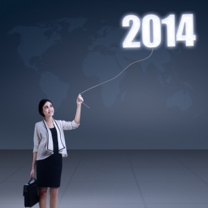 Businesswoman looking at new business future with world map