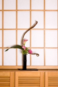 Ikebana flower arrangement in a japanese interior against an authentic shoji sliding window