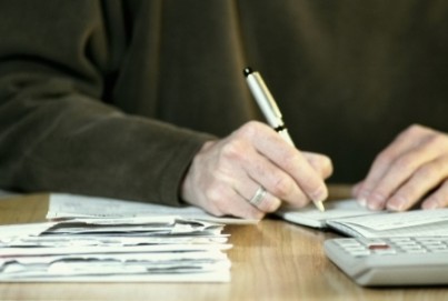 Man paying bills, concept photography, model released