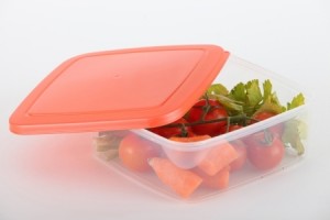 Raw vegetables in a plastic container