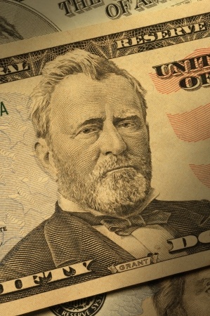 Close-up of Ulysses S. Grant on the $50 bill, dramatically lit
