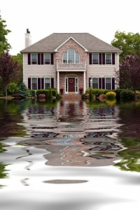 House with flood damage concept with water reflections.