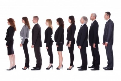 Long line of diverse professional business people standing in a queue