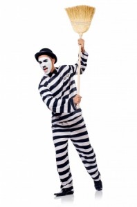 Prisoner with broom isolated on the white