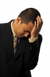 Young business man stress isolated on white background