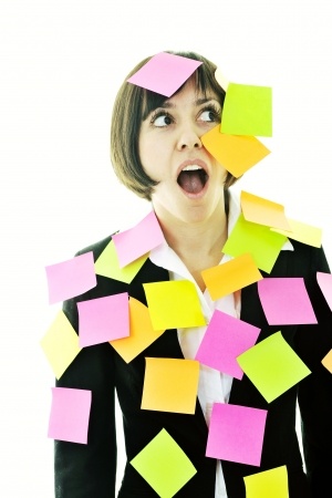 one frustrated young business woman with many of post