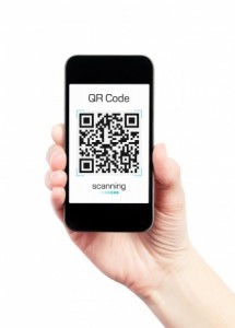 Hand holding mobile smart phone with QR code scanner on the screen. Isolated on white.