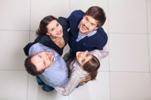 Top view of group of people. Four people looking up