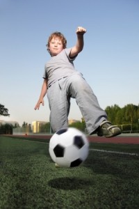 happy boy play in soccer
