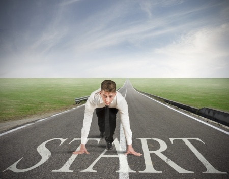 Businessman ready to stard in a road