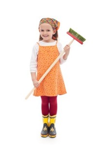 Little girl with broom and rubber boots - isolated