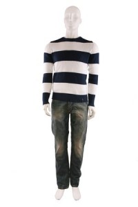 Male mannequin dressed in sweater and jeans and isolated on white