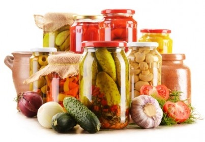 Composition with jars of pickled vegetables