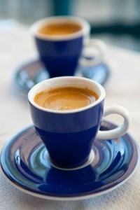 Two cups of delicious fresh greek coffee on an outdoor cafe table