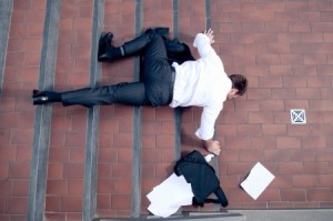 Businessman falling down the stairs