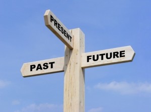 Isolated wooden signpost with the text past, present and futurejpg