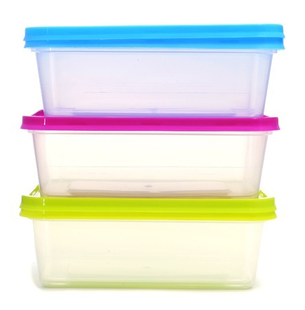 a pile of plastic containers on a white background