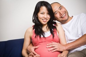 A shot of a happy asian couple expecting for their unborn