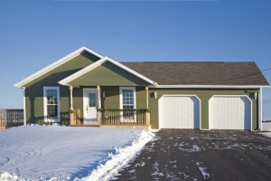 A small family home with a double car garage during the winter
