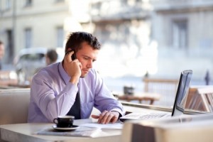 Authentic image of a businessman working in a coffee shop