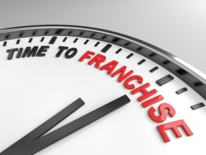Clock with words time to franchise on its face